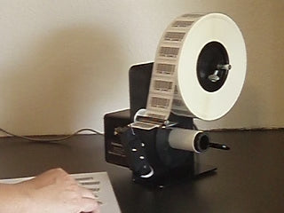 Video of semi-automatic label dispenser in use